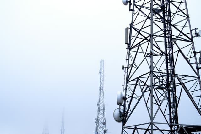 a tower with several cell phones on top of it