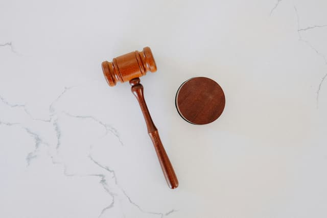 wooden gavel and block on marble